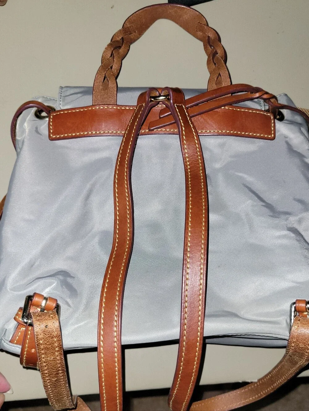 Dooney & Bourke Light Gray Nylon Backpack with Brown Leather Trim.